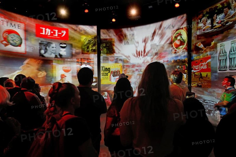 Visitors view interactive canvases at the Coca-Cola Museum in Atlanta, Atlanta, Georgia, USA