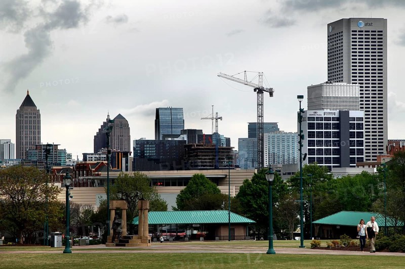 Atlanta skyline with cranes and green landscape, Atlanta, Georgia, USA