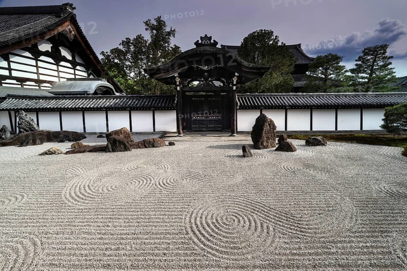 Zen garden with gate and detailed gravel patterns in Tofuku-ji Temple
