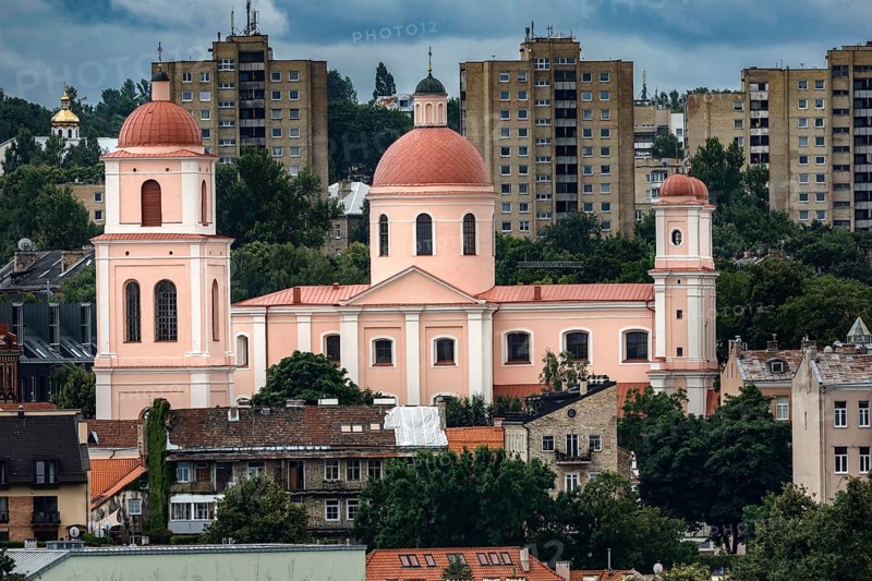 Church with red domes in front of modern residential buildings in Vilnius, Vilnius, Lithuania