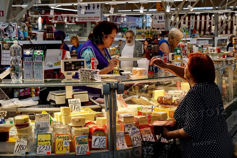 Market visitors shop at busy stands in Riga Central Market, Riga, Latvia