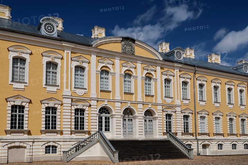 Ruhenthal Castle with classic baroque façade under bright blue sky, Rundale, Latvia