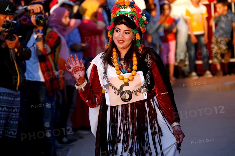 Woman in festive dress parading during the Fête des Roses, El Kelâa m'Gouna, Marrakesh-Safi, Morocco