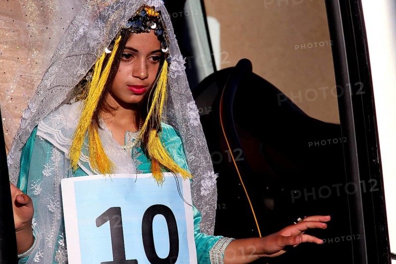 Participant in the Miss Voting at the Fête des Roses in traditional dress, El Kelâa m'Gouna, Marrakesh-Safi, Morocco