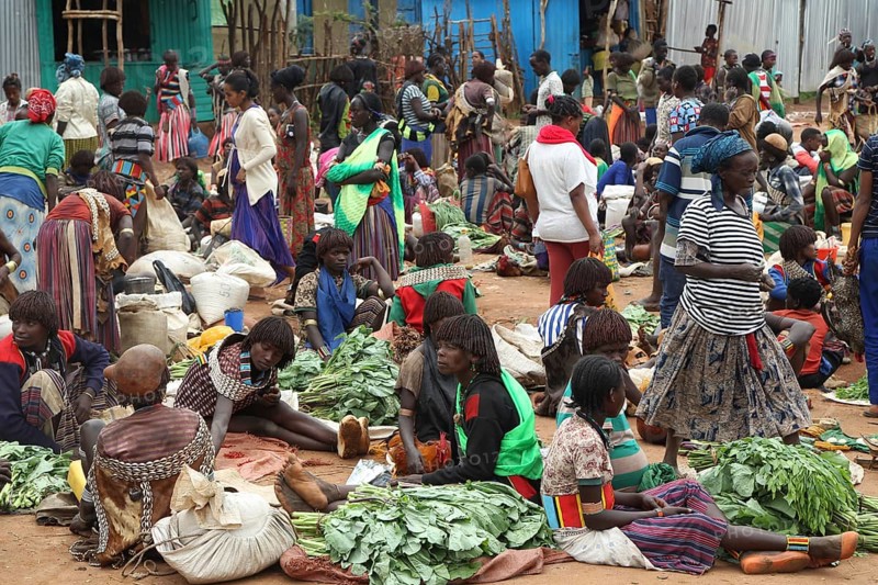 Lively market with people wearing traditional clothes, Key Afar, Ethiopia
