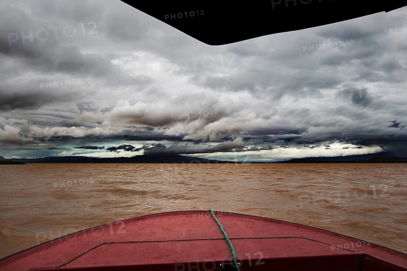 Threatening skies and gloomy waters on a boat trip across Lake Chamo, Nech Sar National Park, Ethiopia