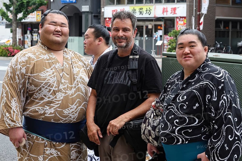 Two sumo wrestlers with a tourist in Ryogoku, Tokyo, Ryogoku, Japan