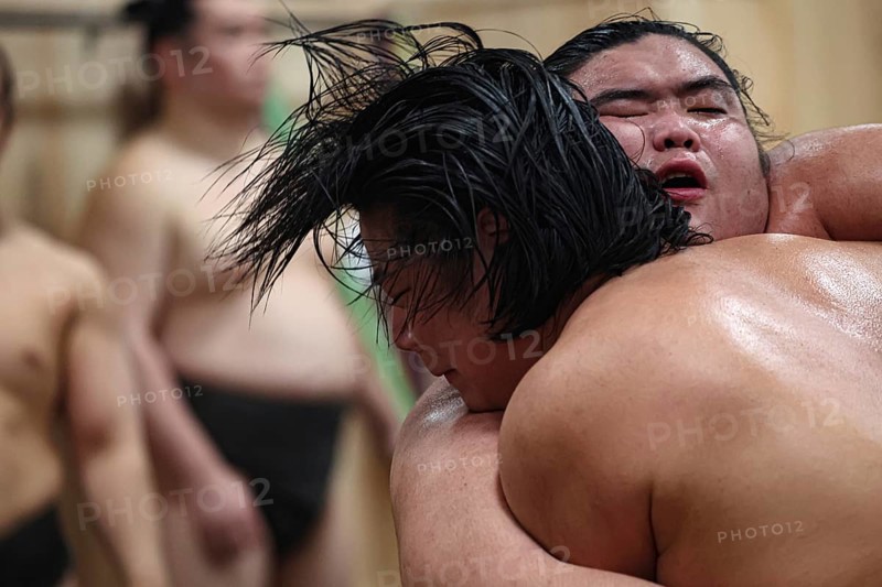 Close-up of two athletes fighting a sumo at the training center, Tokyo, Ryogoku, Japan