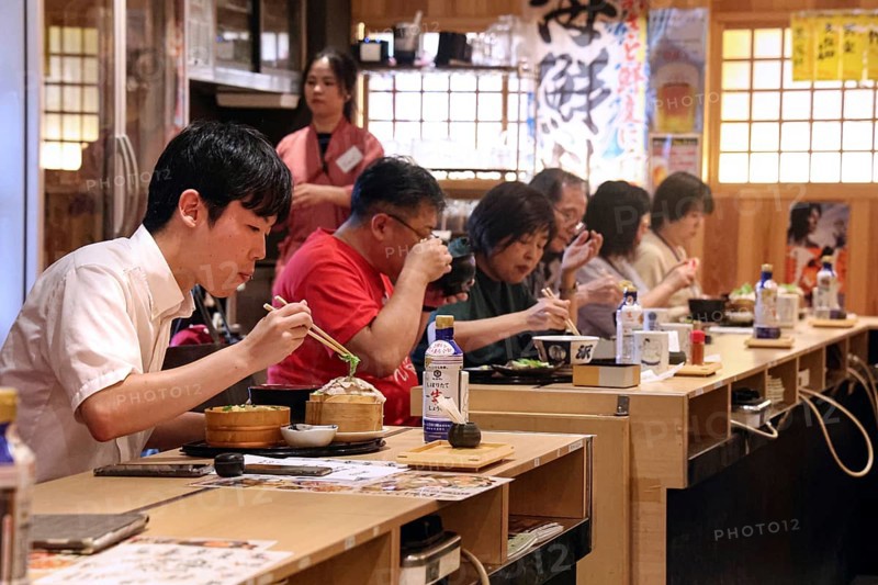 People enjoying meal at traditional restaurant in Ryogoku, Tokyo, Ryogoku, Japan