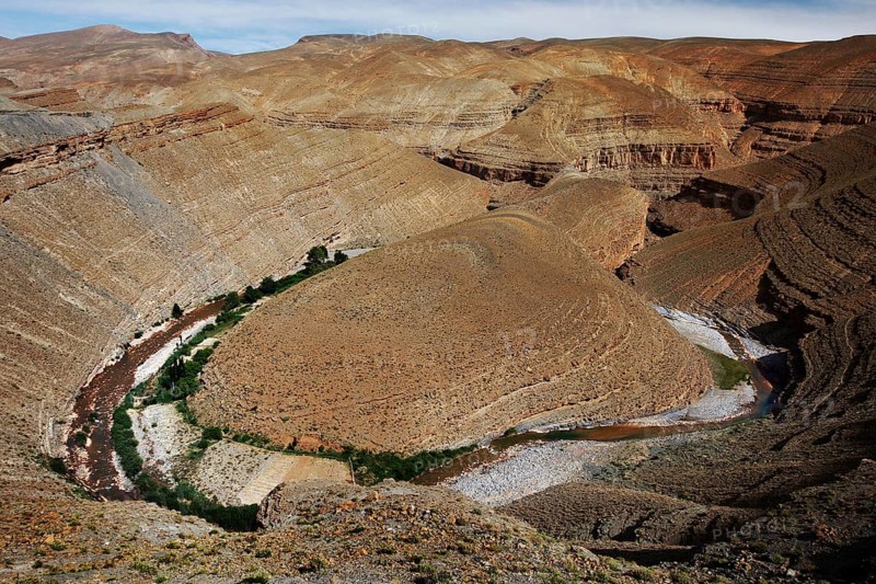 Impressive geological formations in the Dadès Canyon with a river, Dadès Gorge, Morocco
