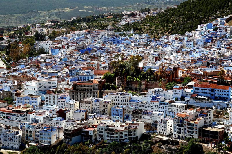 Panoramic view of the blue city of Chefchaouen nestled in a mountainous landscape, Chefchaouen, Tanger-Tetouan, Morocco