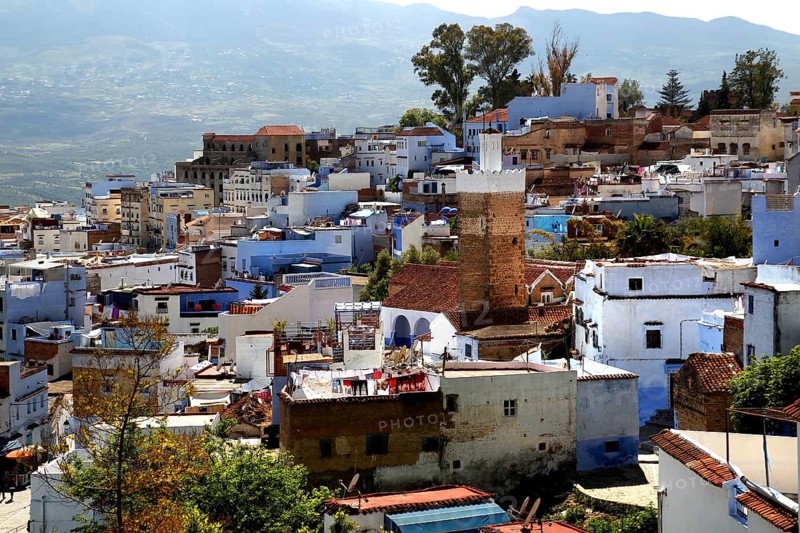 Panoramic view of the iconic blue town of Chefchaouen with surrounding mountains, Chefchaouen, Morocco