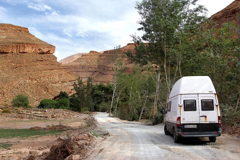 Road with a vehicle leads through the impressive scenery of the Dadès Gorge, Dadès, region, MA