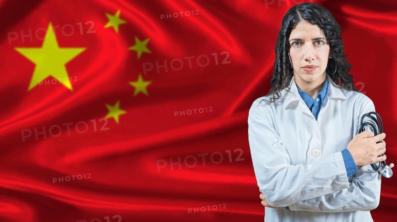 Chinese national health system, Medical professional on China flag background