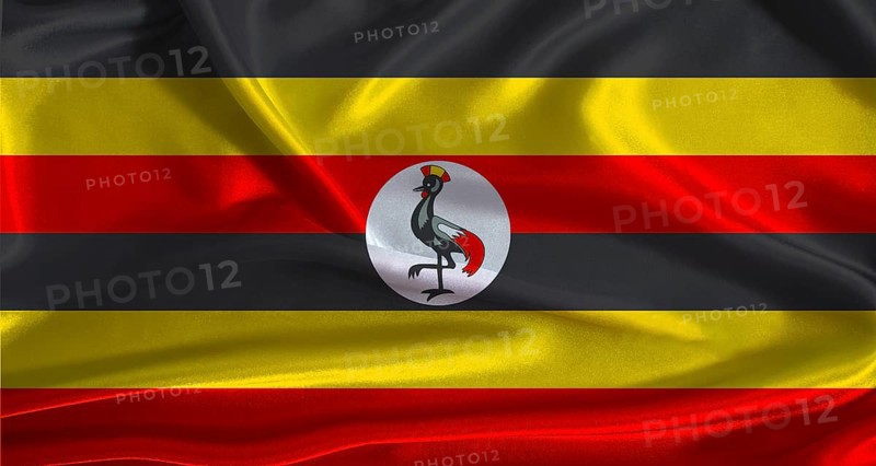 Uganda flag with cloth textured background. National flag of Uganda with realistic texture