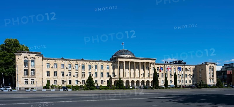 Extensive classical building in panoramic view under bright blue sky, City Hall, Gori, Inner Kartli Region, Georgia