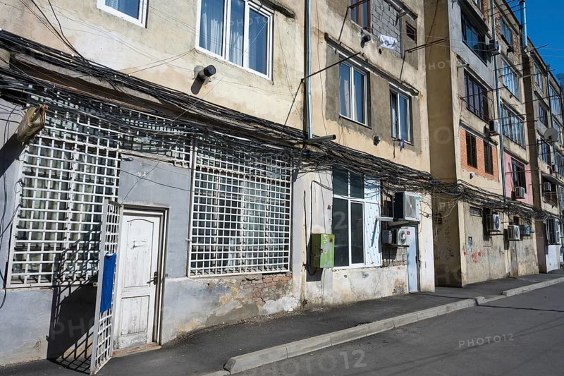 Multi-storey apartment block with lots of exposed cables and aged façade, Gori, Inner Kartli region, Georgia