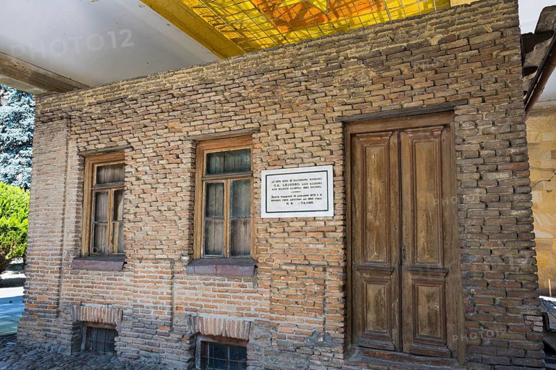 Brick wall of a building with wooden doors and windows, rustic appearance, birthplace of Josef Stalin, Gori, Inner-Kartli region, Georgia