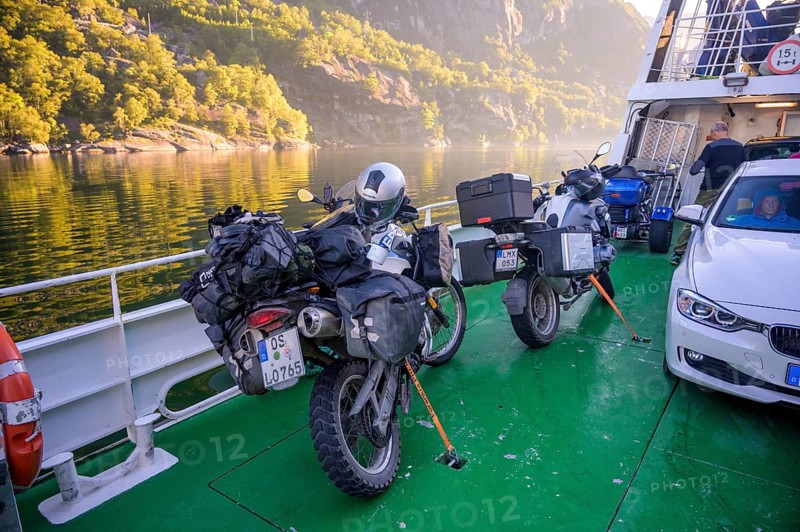 Motorbikes with luggage on a Kolumbsu shipping company ferry on the Lysefjord in sunny weather, Lysefjord, Rogaland, Norway