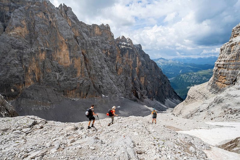 Three climbers descending the Sentiero Martinazzi, Camosci Valley, Brenta Mountains, Brenta-Adamello Natural Park, Trentino, Italy