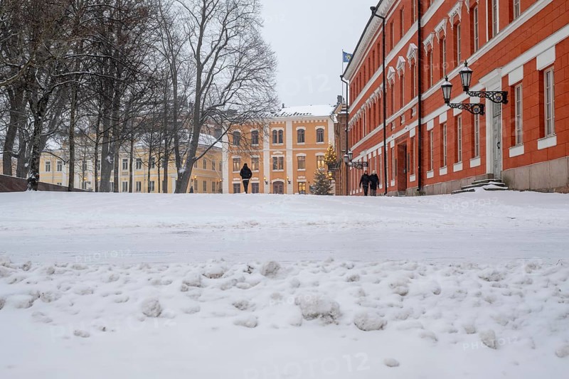 Pedestrians, historic buildings, wintery Turku or Swedish Åbo, Varsinais-Suomi, Finland