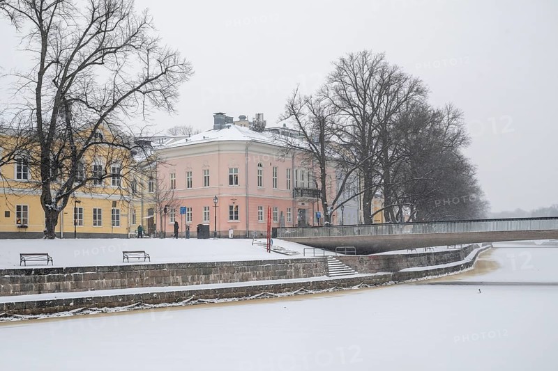 Historic buildings on the frozen Aurajoki river, wintery Turku or Swedish Åbo, Varsinais-Suomi, Finland