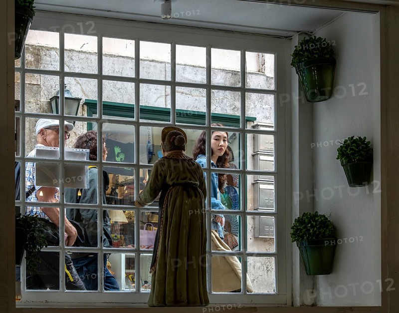 View of passers-by on the street through a cafeteria window, Sintra, Lisbon, Portugal