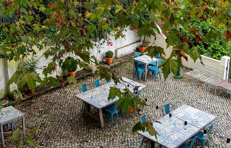 Empty tables in a garden restaurant in Sintra, Lisbon, Ortugal