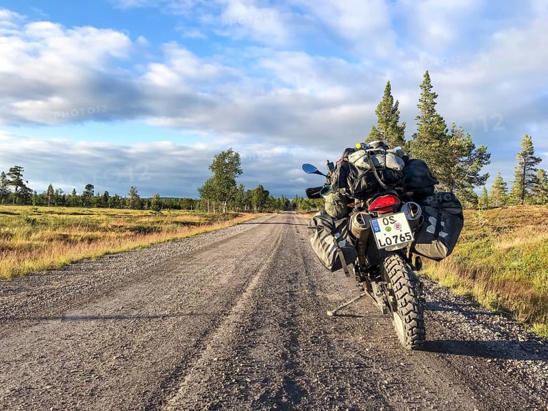 Idre, Dalarnas län, Sweden, BMW G 650 GS Sertao enduro motorcycle on a sunny road in the middle of a picturesque landscape