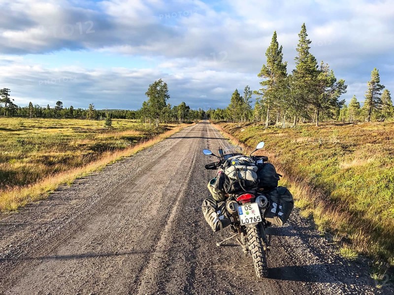 Idre, Dalarnas län, Sweden, BMW G 650 GS Sertao Enduro motorcycle stands on a country road with a wide view over fields and trees