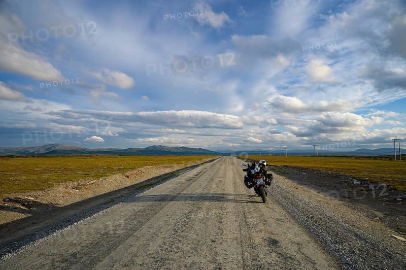 Falkvålen, Bruksvallarna, Jämtland, Sweden, BMW G 650 GS Sertao enduro motorcycle on a country road, clouds draw the sky, endless adventure