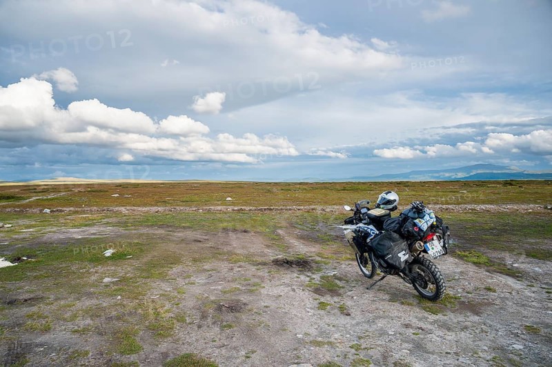 Falkvålen, Bruksvallarna, Jämtland, Sweden, BMW G 650 GS Sertao enduro motorcycle on a wide area under a dynamic, cloudy sky