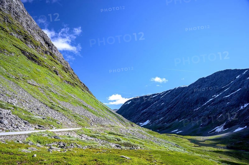Geiranger, Møre og Romsdal province, Norway, mountain landscape with Geirangervegen road, under clear blue sky