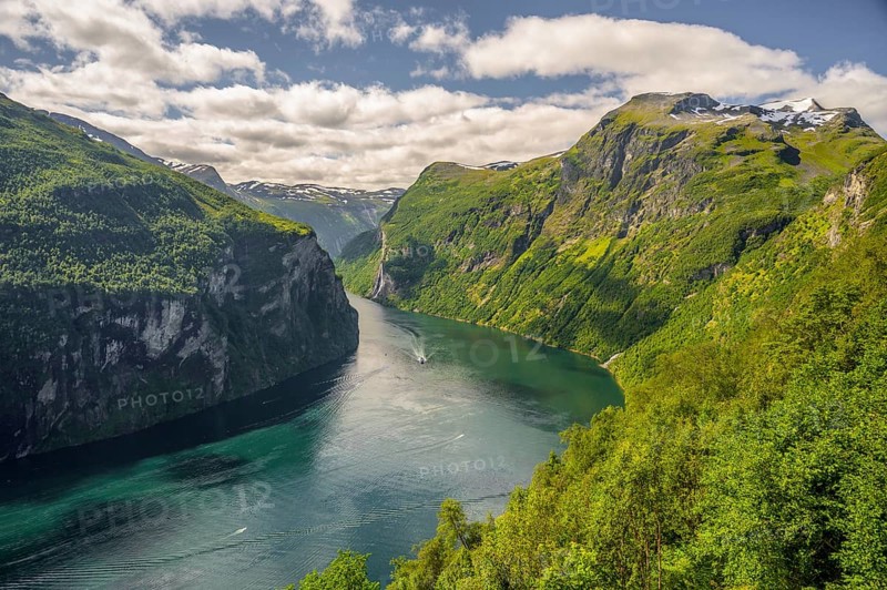 Geiranger, Møre og Romsdal Province, Norway, Majestic Geiranger Fjord with turquoise water and steep green mountain slopes