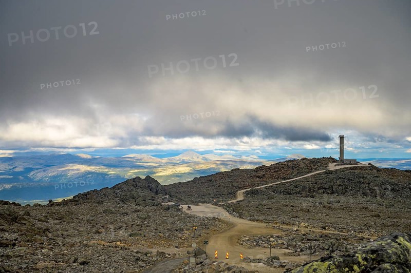 Alvdal, Innlandet, Norway, Extensive view over a rocky plateau under a cloudy sky, road to Tronfellet with an altitude difference of 1161 m the highest passable road in Norway