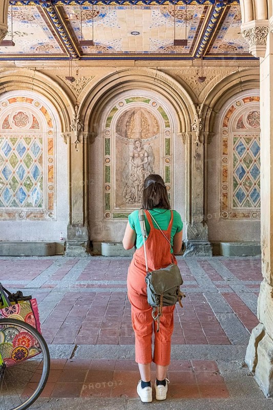 Woman photographs the wall decorations, Bethesda Terrace, Central Park, Manhatten, New York City, USA