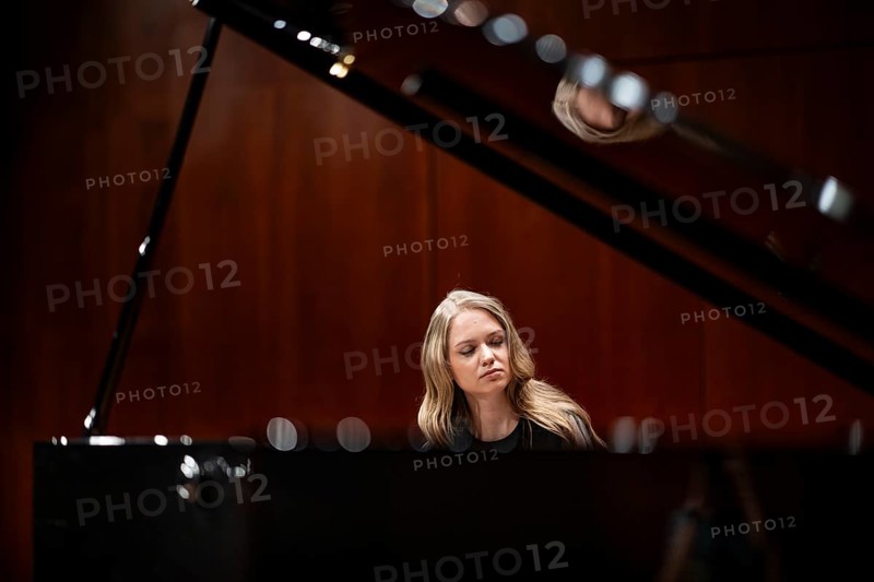 Young woman, pianist, with concentrated facial expression and closed eyes playing on a Steinway & Sons grand piano, Stuttgart, Baden-Württemberg, Germany
