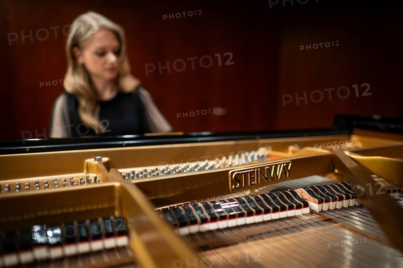 Young woman, pianist playing on a Steinway & Sons grand piano, Stuttgart, Baden-Württemberg, Germany