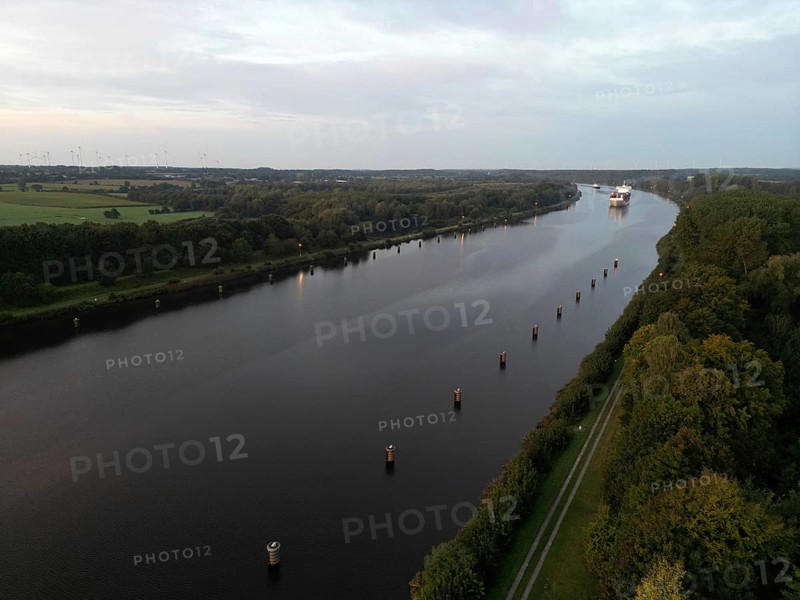 Drone shot, container ship at sunrise in the Kiel Canal, NOK, Kiel Canal, Kiel Canal, Schleswig-Holstein, Germany