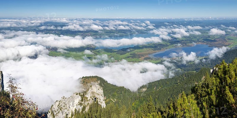 Panorama from Tegelberg, 1881m, of the cloud-covered Forggensee and Bannwaldsee, Ostallgäu, Bavaria, Germany