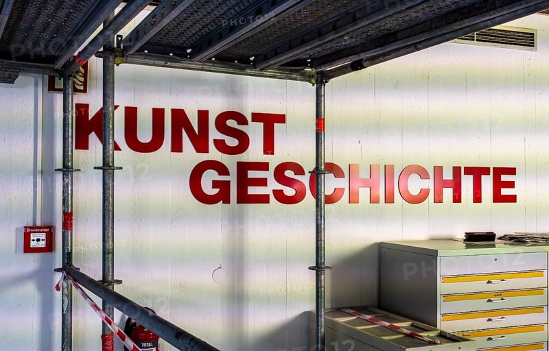 Technical University in Berlin, provisional information sheets and signs at an indoor construction site show the way towards the library, Berlin, Germany