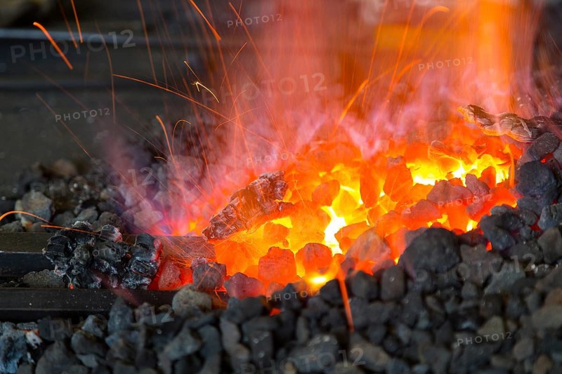 A blacksmith forging, working at the Ehnert forge in Dresden-Bühlau, Saxony, Germany