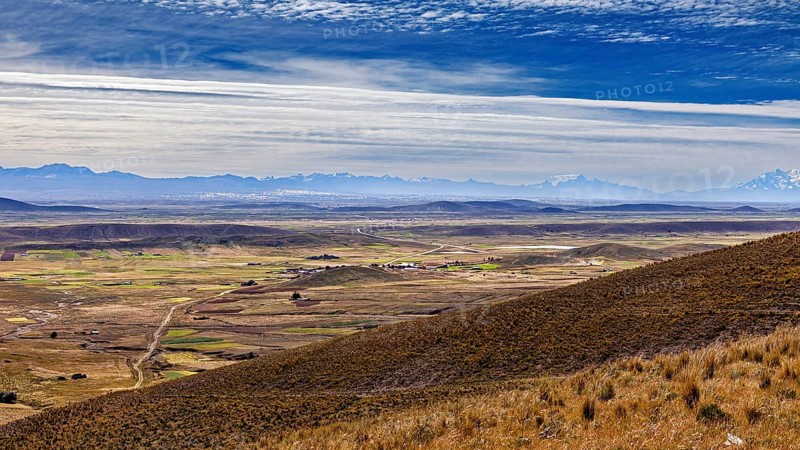View of hilly landscape with cloudy sky, The Altiplano landscape in the Andes of Bolivia