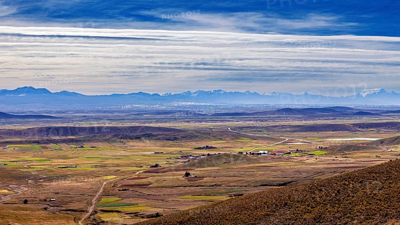 Extensive landscape with fields and mountains on the horizon, The landscape of the Altiplano in the Andes of Bolivia