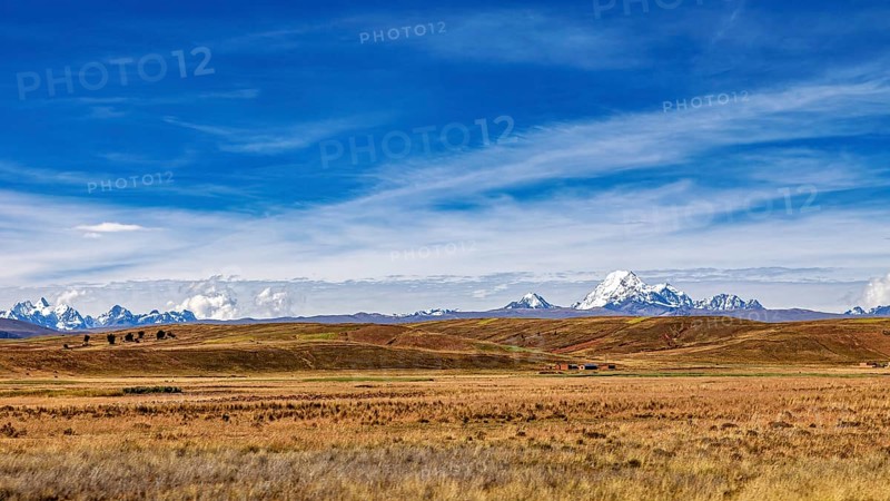 Wide hilly landscape with mountains and a cloudy sky, The Altiplano landscape in the Andes of Bolivia
