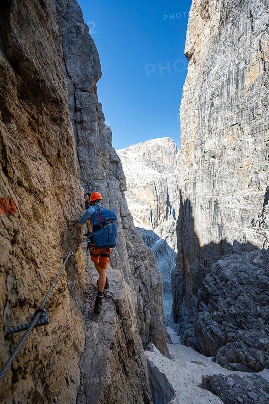 Climbers on the Via Ferrata Bocciere Centrale via ferrata, spectacular mountain landscape with steep rock faces, Brenta Mountains, Parco Naturale Brenta-Adamello, Trentino, Italy