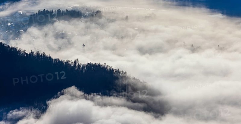 View of a sea of fog from Vormauerstein, Strobl am Wolfgangsee, church tower sticking out of the fog, inversion weather, Osterhorn Group, Salzkammergut, Province of Salzburg, Austria
