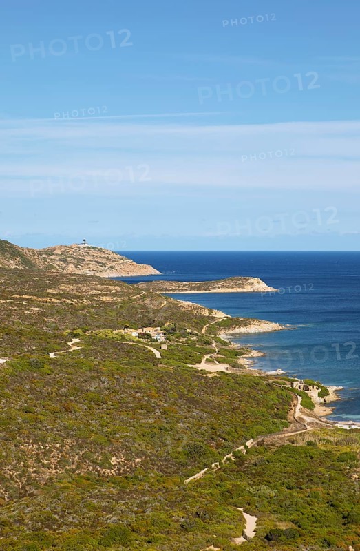 Coast at Punta de la Revellata, behind the lighthouse, Calvi, Haute Corse Department, Corsica, France