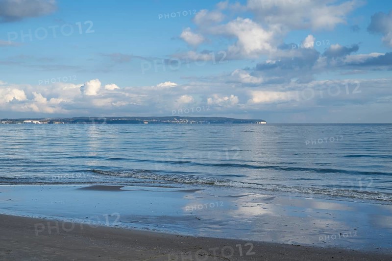 View across the Baltic Sea towards chalk coast, beach, sky with white clouds, Binz, seaside resort, island of Rügen, Mecklenburg-Western Pomerania, Germany