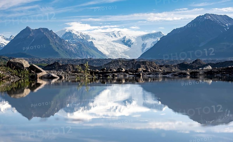 Mountain landscape reflected in glacial lake, Mount Blackburn and Kennicott Glacier, McCarthy Road, Wrangell St. Elias National Park, Alaska, USA